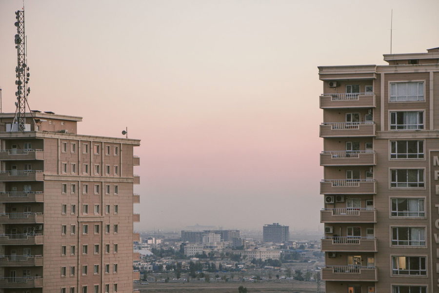 Scenic view of city skyline with high-rise buildings during a serene dusk.